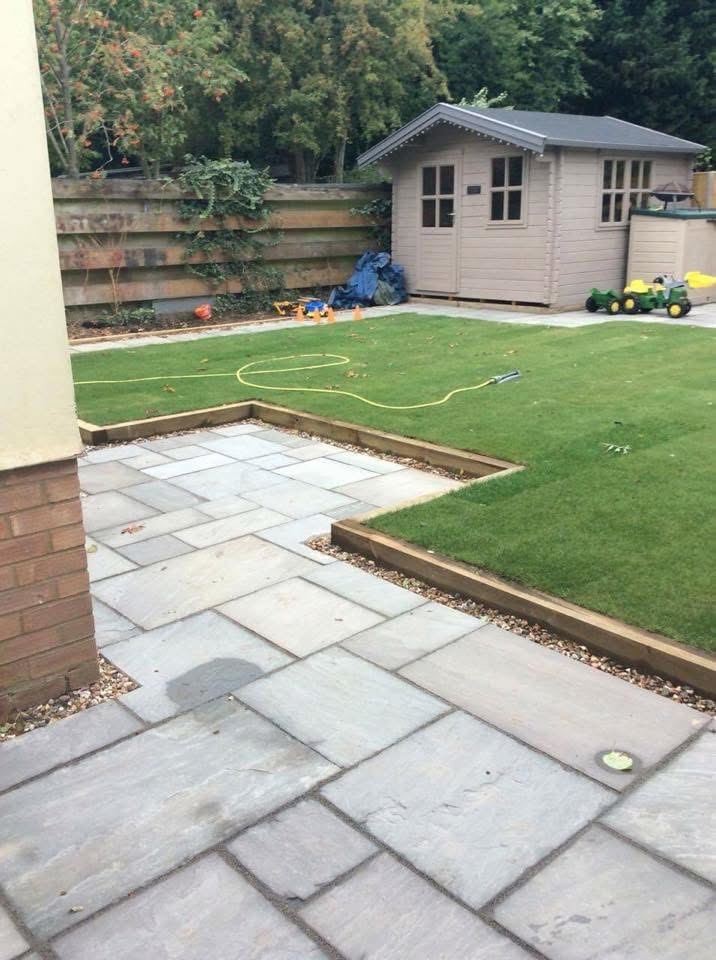 Garden landscaping with new turf and stepped paving